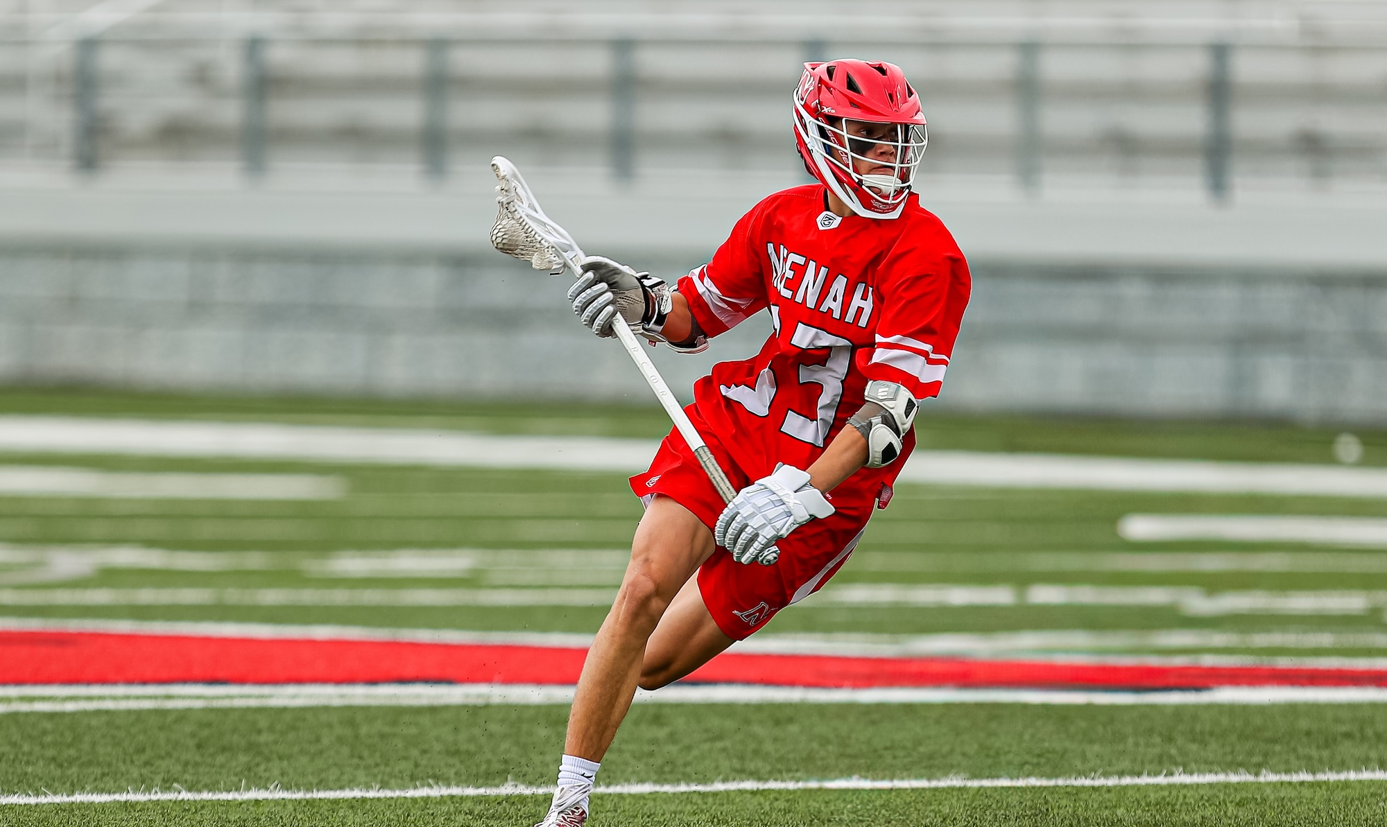 Boys Lacrosse Player mid pass
