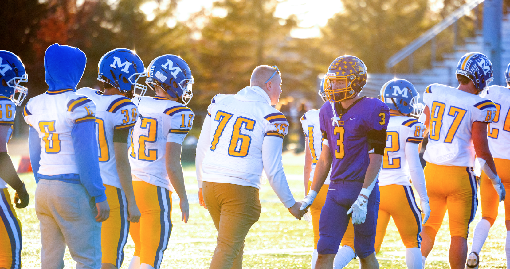 two 8 player football teams shake hands