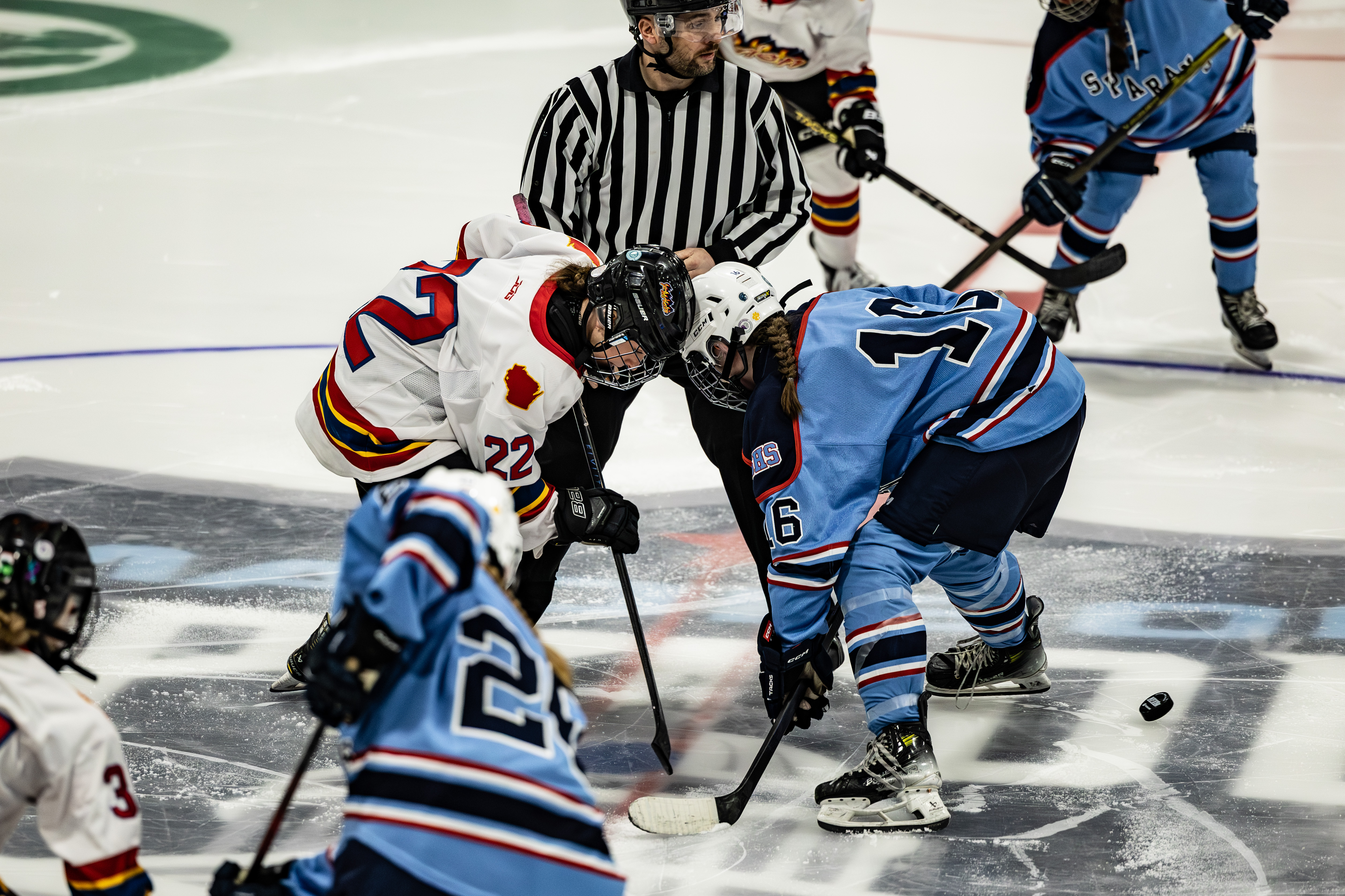 girls playing hockey
