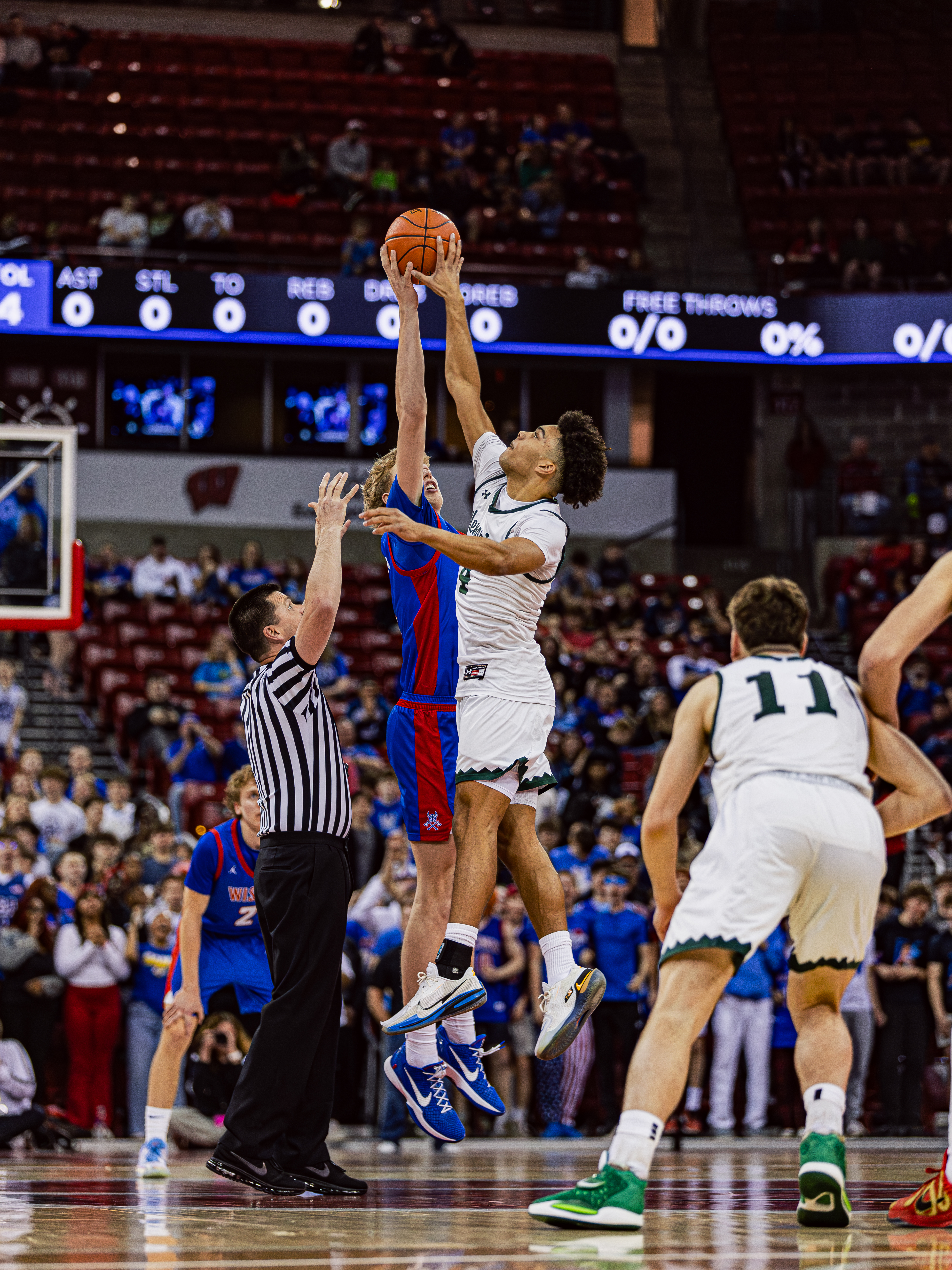 two basketball player during a jump ball