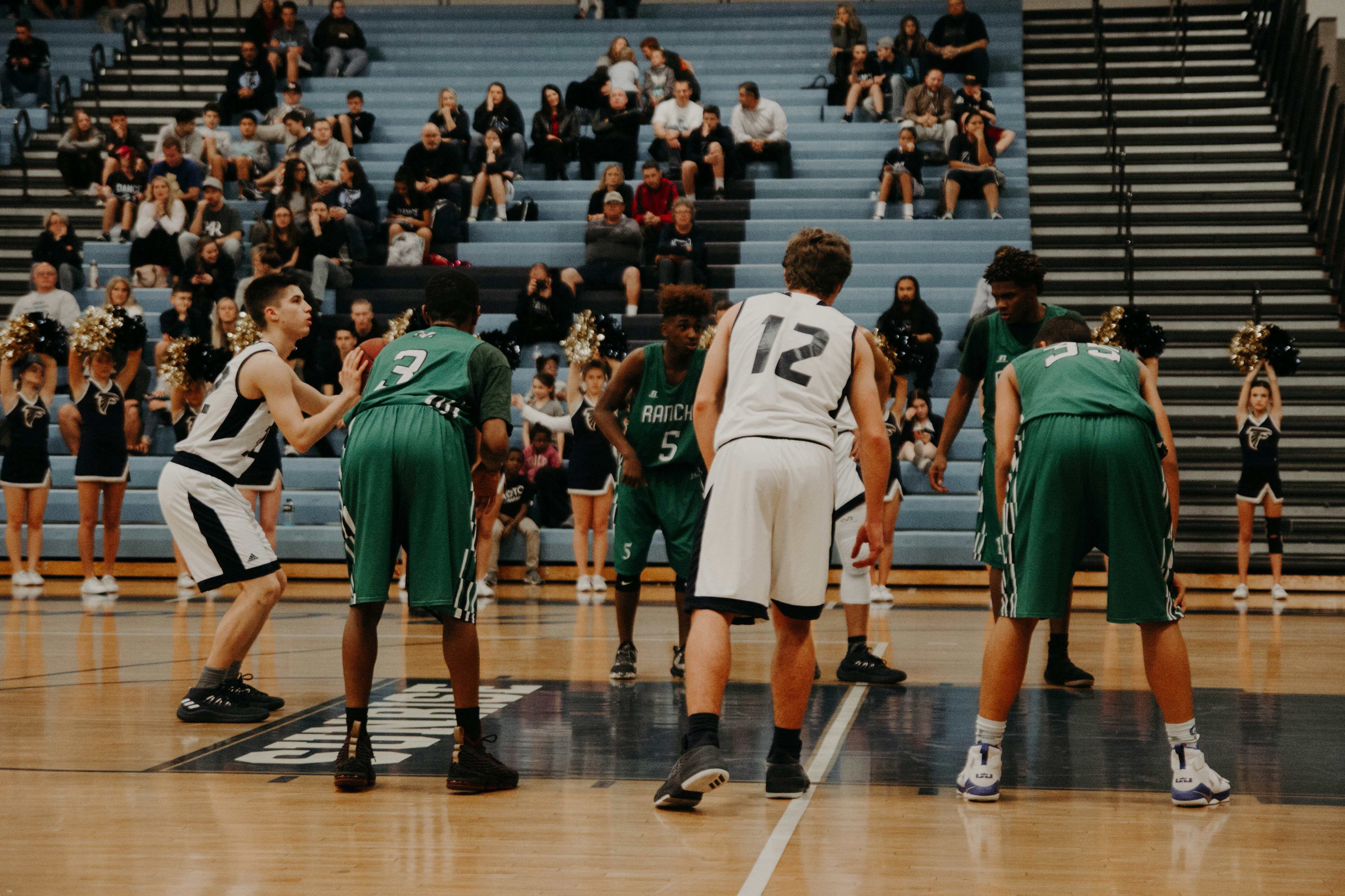 A high school basketball player gets ready to shoot a free throw.