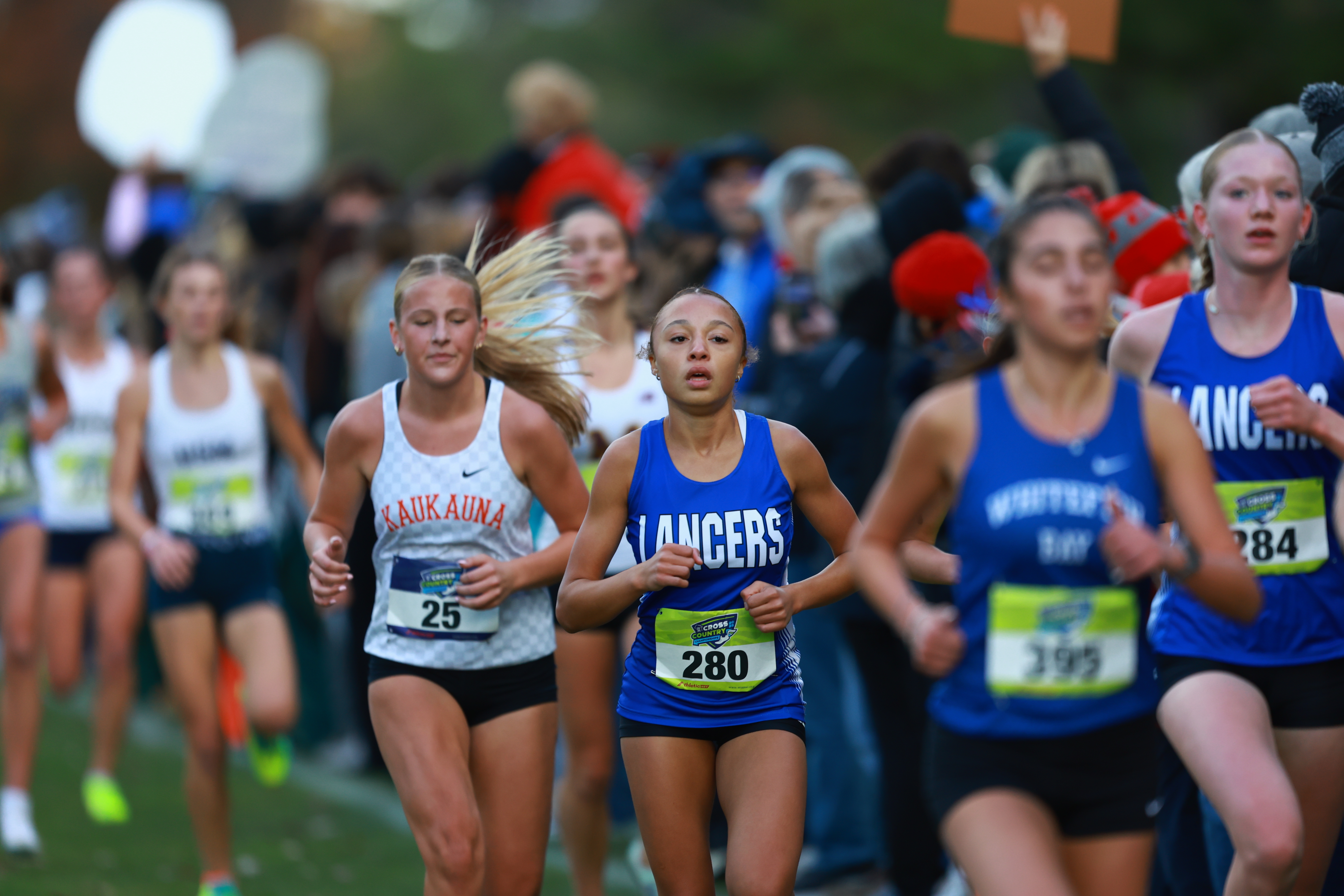 girls running in a cross country race