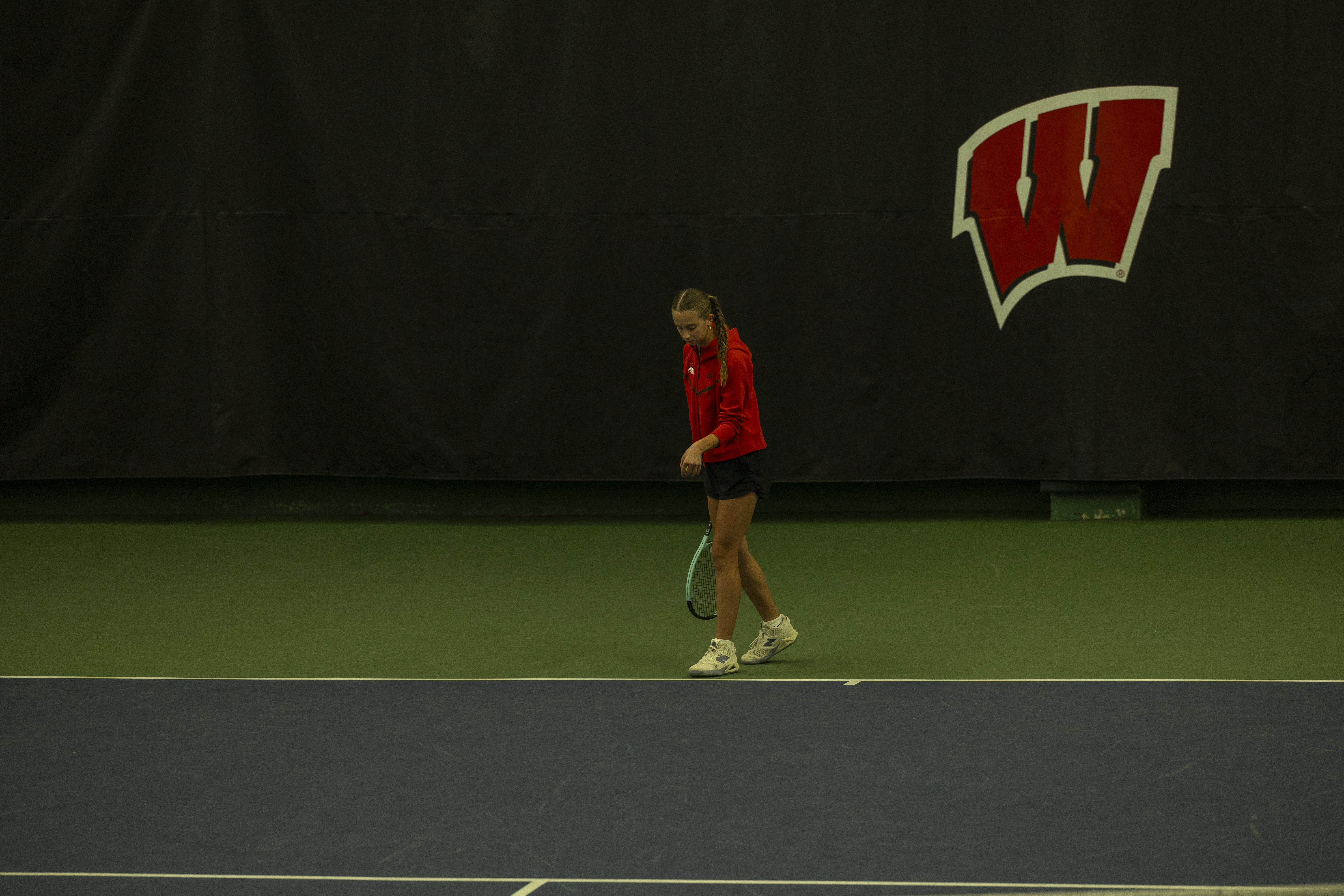 girl playing tennis at state tournament