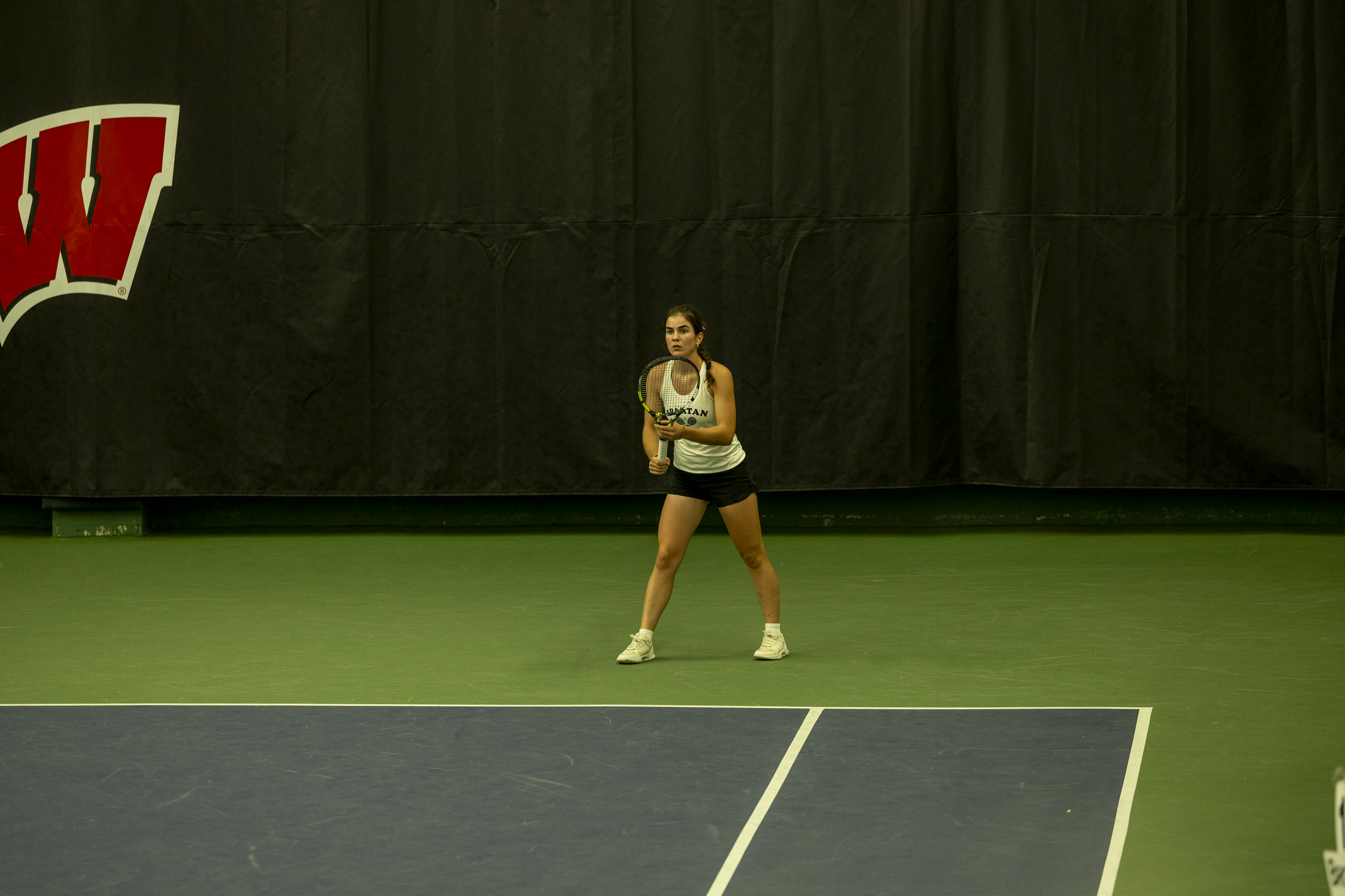 girl playing tennis at state tournament